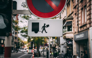 Delivery man on traffic sign